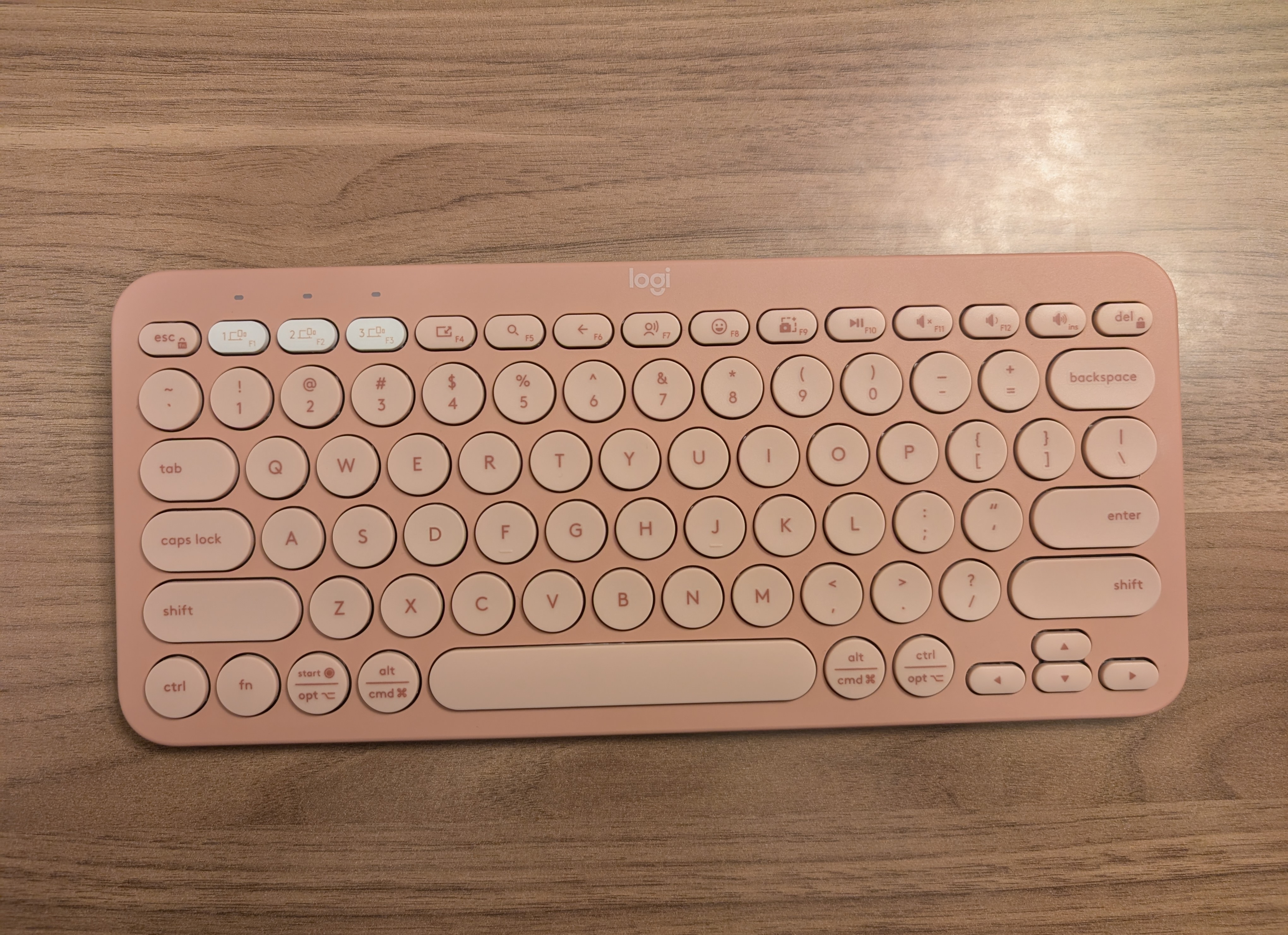 A small pink keyboard, pretty similar to the last one, but the body is darker while the keys are lighter.